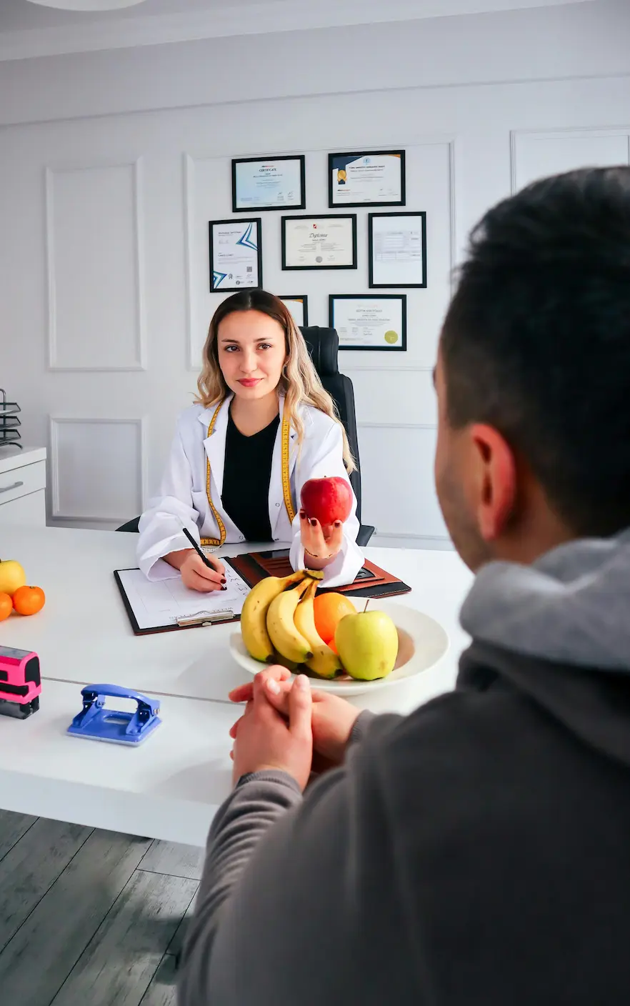 Maya Chen - Certified Pasadena Nutritionist consulting with client about gut health